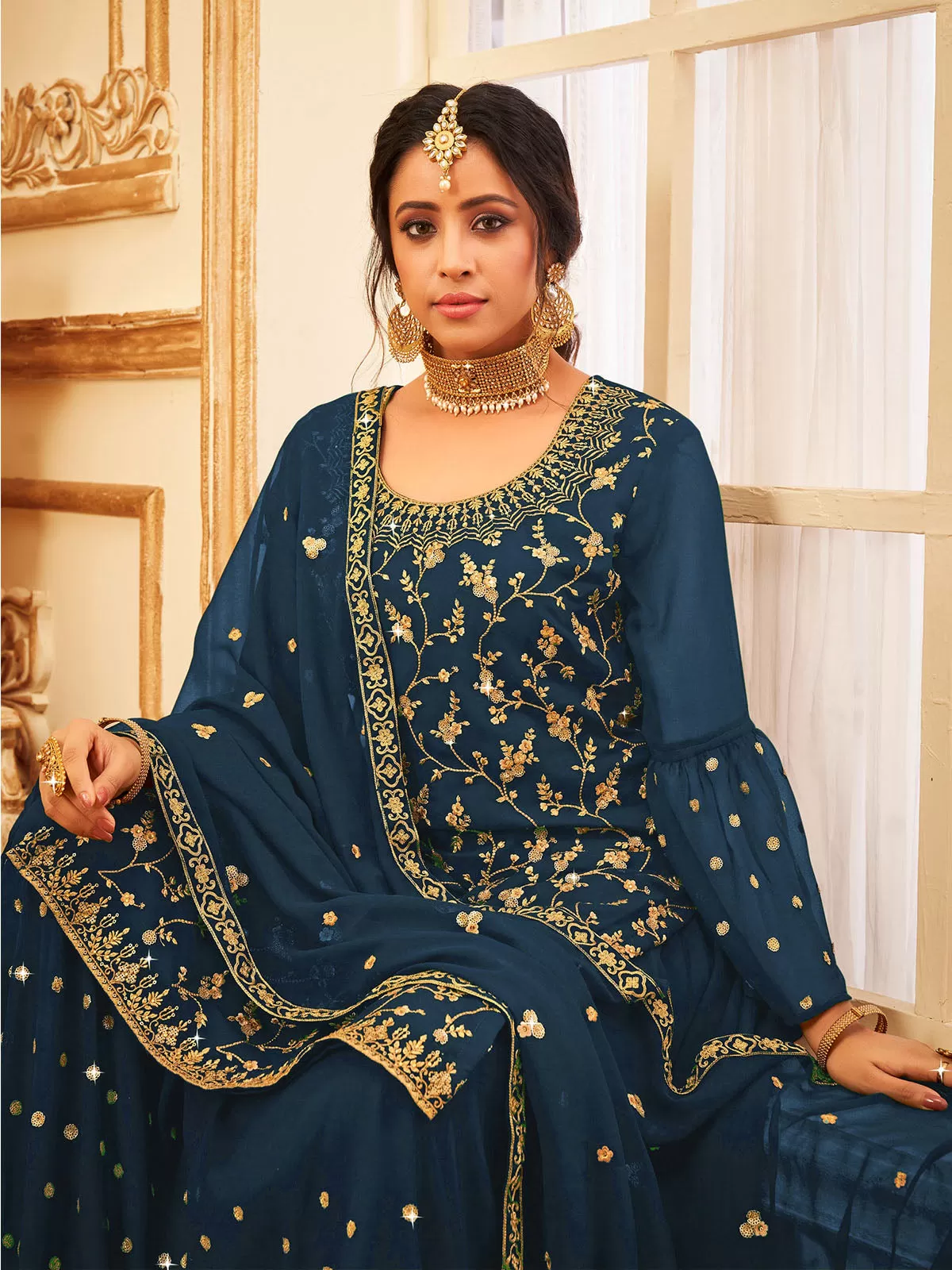 Odette Women Navy Blue Faux Georgette With Glitter Sequence Work Semi Stitched Sharara Suit